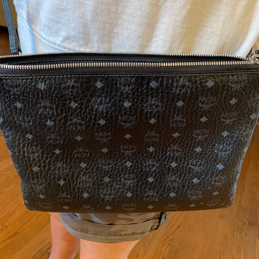 MCM crossbody bag in black with silver logos.